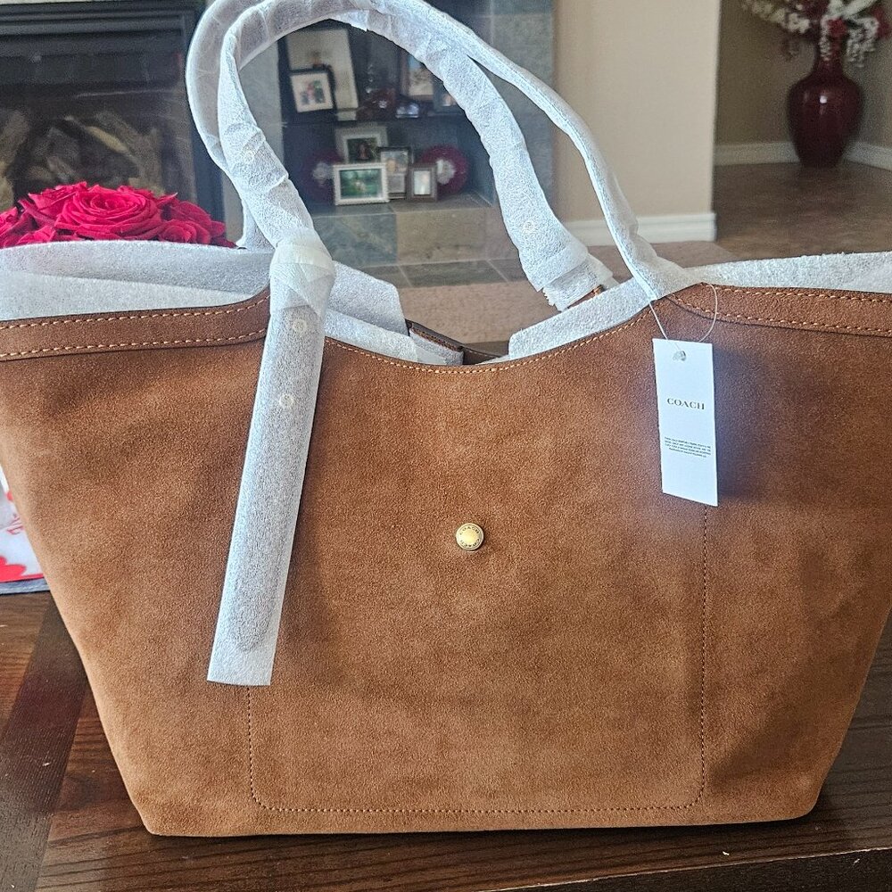New with tags.  suede brown coach gramercy. SOLD OUT